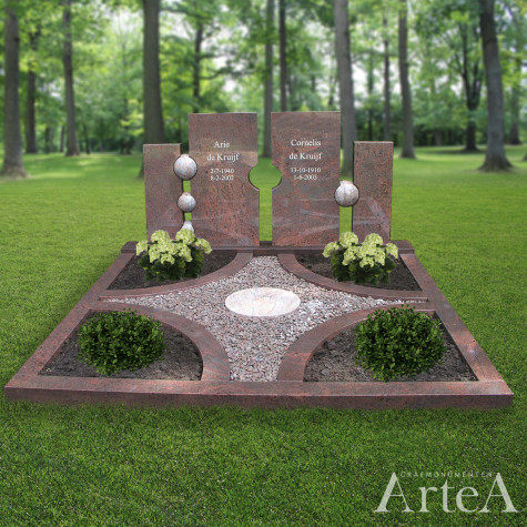Dubbelgraf van rood graniet met verschillende bollen en tuin met planten