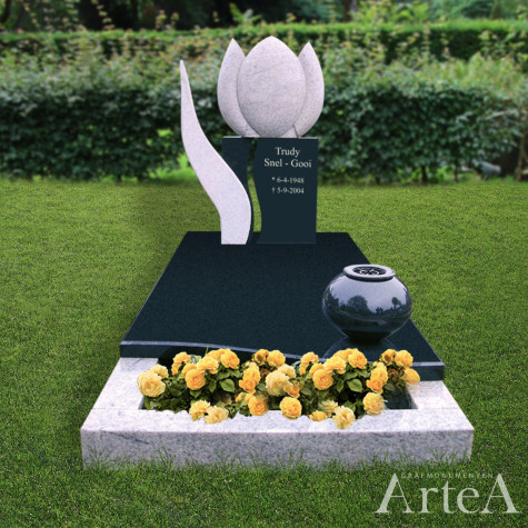 Grafsteen met tulp en zwart graniet grafmonument met tuin en planten