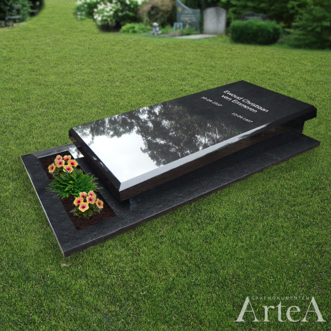 Liggende grafzerk zwart graniet met tuin en bloemen