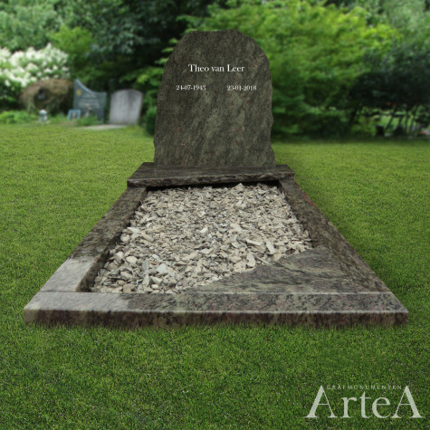 Ruwgekapt grafmonument met groen graniet deze grafsteen heeft ook nog grind in de tuin