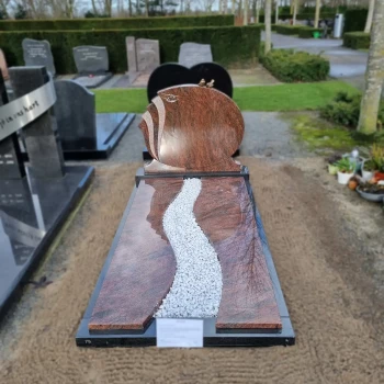 grafsteen met rood graniet geplaatst